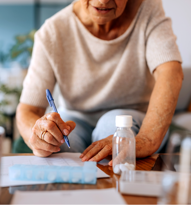 Patient-writing-medication-list-vertical Patient-writing-medication-list-vertical